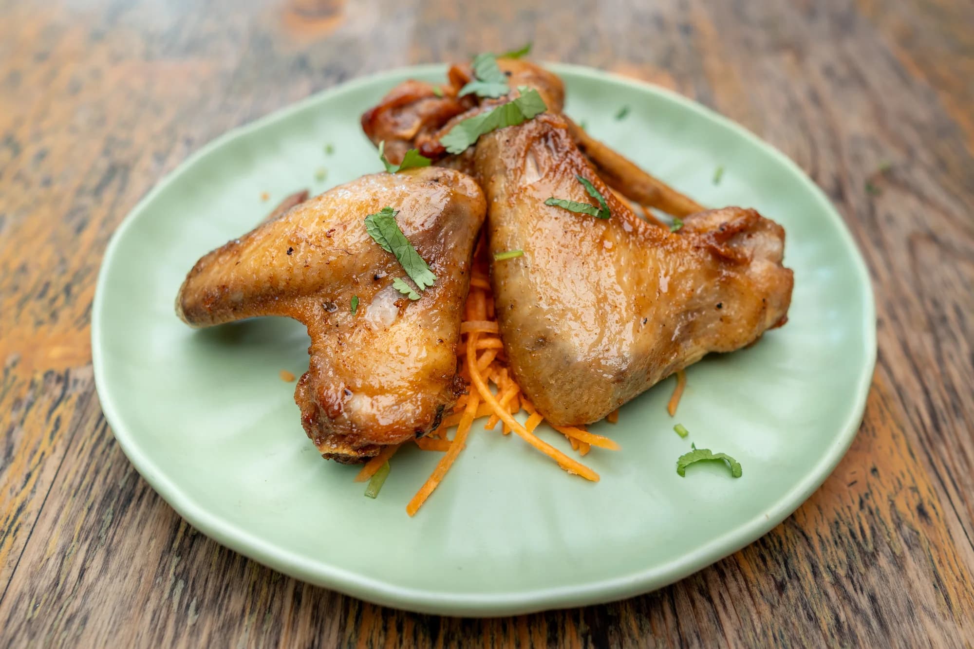 Golden chicken wings with fresh herbs at Viet Nom Nom, New Plymouth