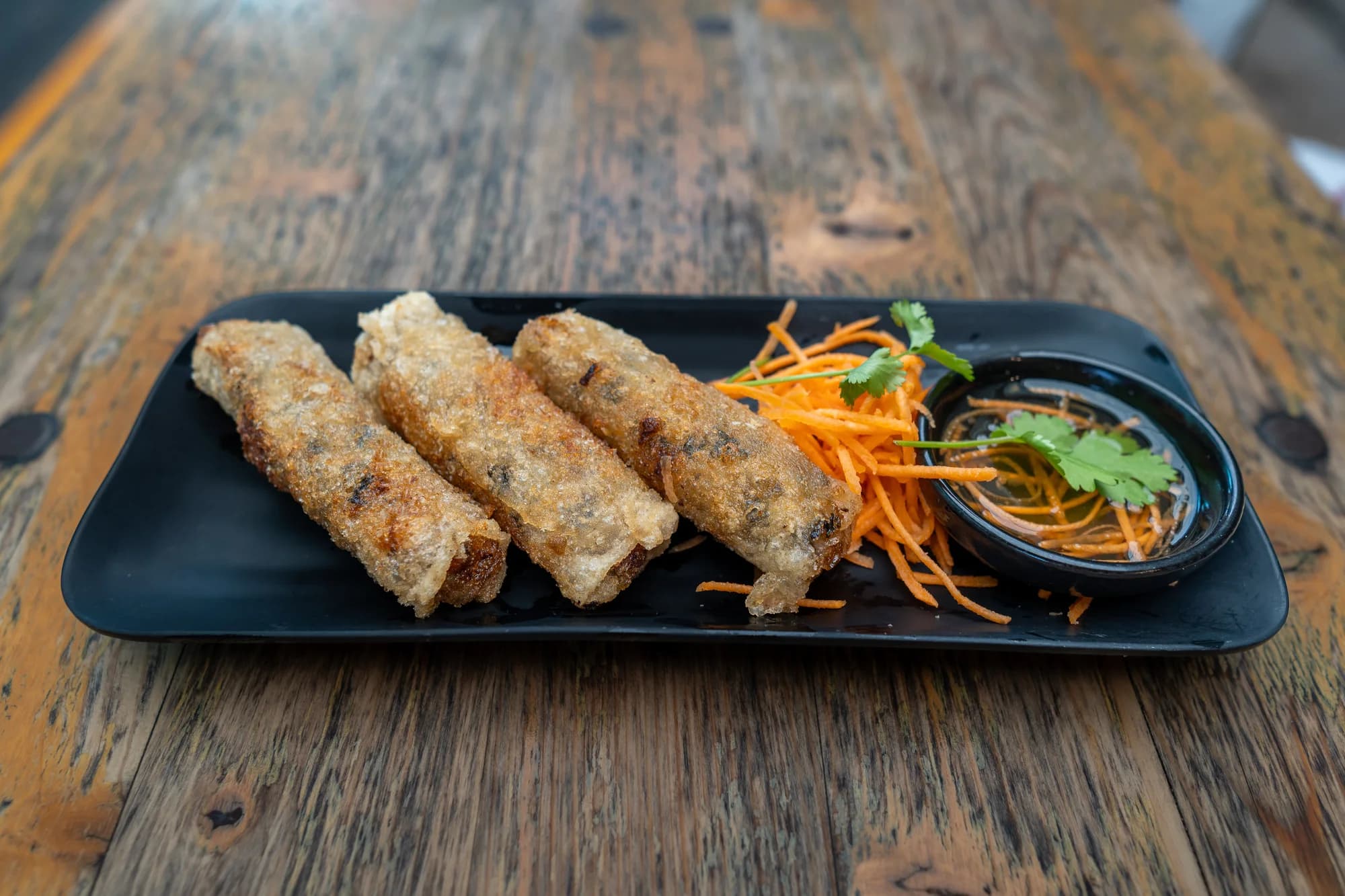 Crispy spring rolls with dipping sauce at Viet Nom Nom, New Plymouth